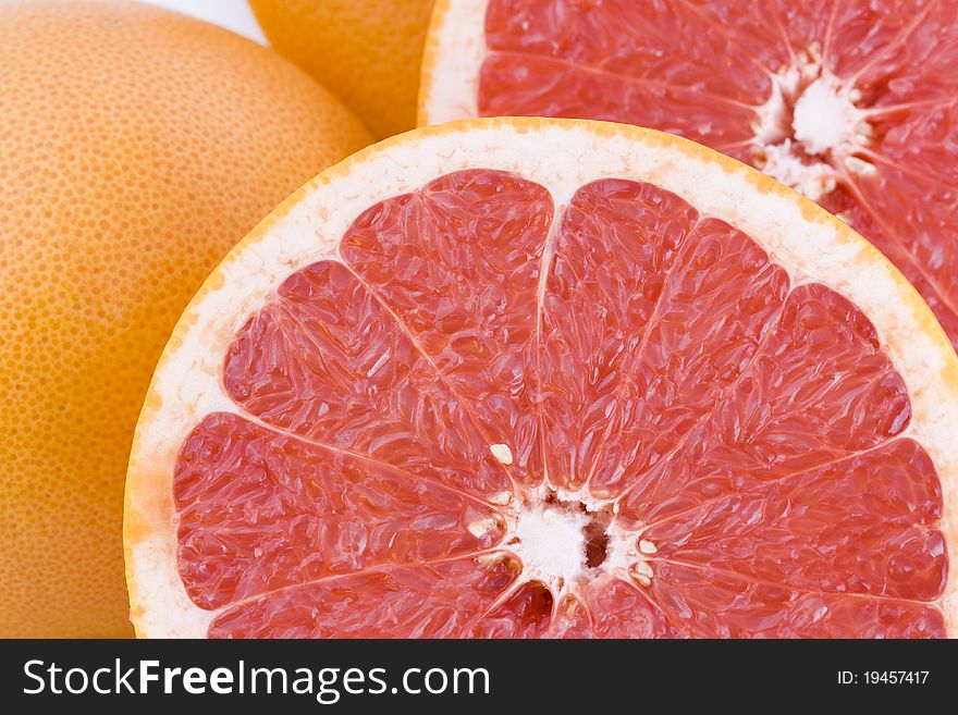 Fresh red grapefruit slices closeup, fruit background. Fresh red grapefruit slices closeup, fruit background