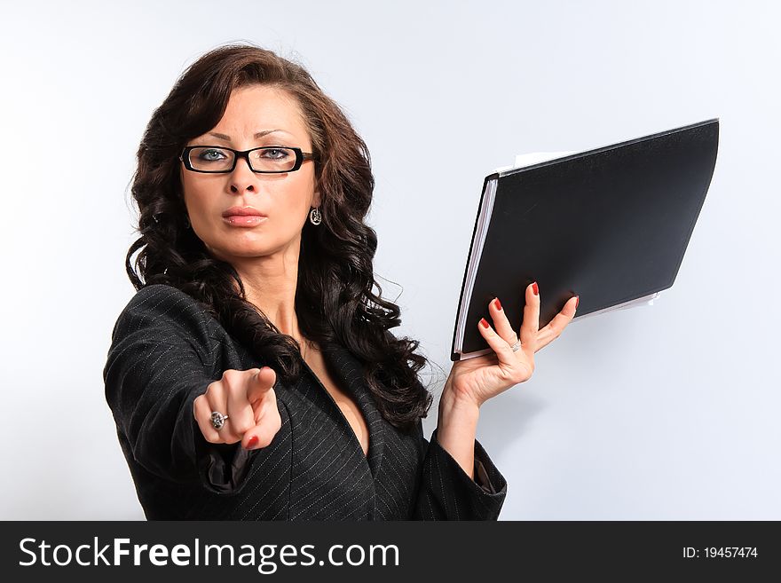 Portrait of confident business woman in the background documents