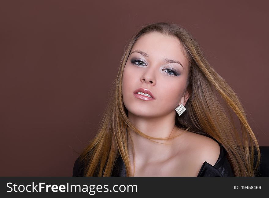 Portrait of a beautiful young sexy woman with long flying hair, studio shot. Portrait of a beautiful young sexy woman with long flying hair, studio shot