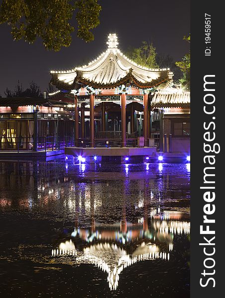 Night scene of pavilion reflection in lake, Beijing Houhai, China