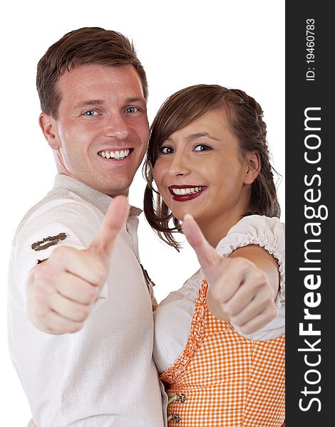 Happy Bavarian man and woman with dirndl hold thumbs up.Isolated on white background. Happy Bavarian man and woman with dirndl hold thumbs up.Isolated on white background.