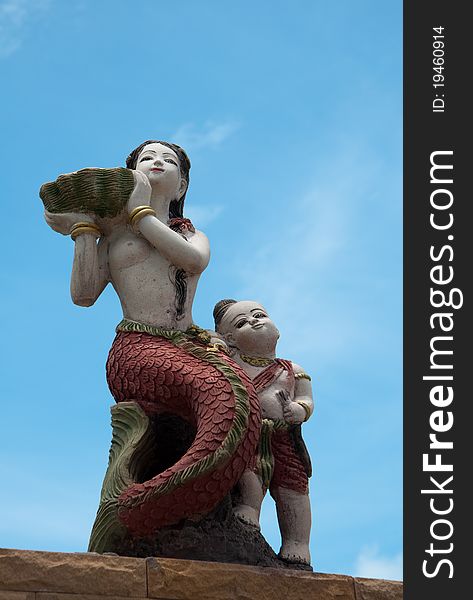 Sculpture mermaid and the child on the beach of east Thailand