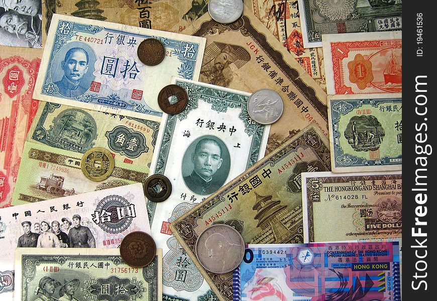 Paper banknotes and coins of China and Hong Kong of different denominations issued at different times. Paper banknotes and coins of China and Hong Kong of different denominations issued at different times.