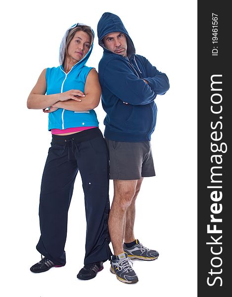 Men and woman in sports clothes in studio