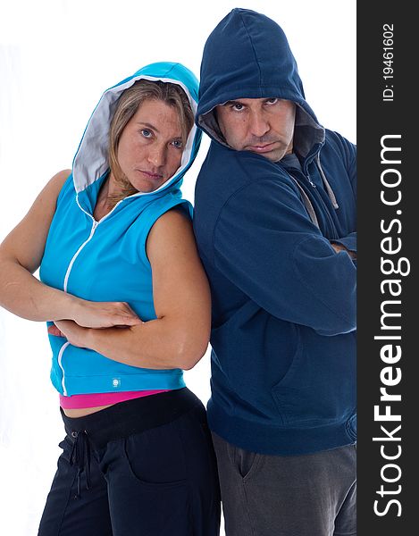 Men and woman in sports clothes in studio