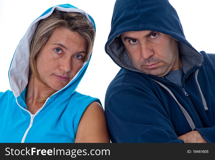 Men and woman in sports clothes in studio