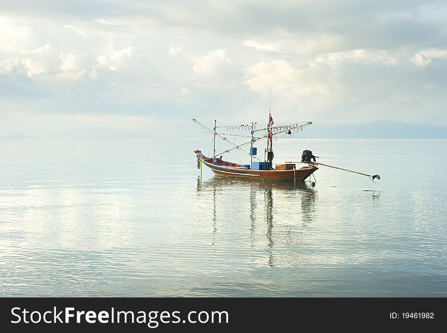 Traditional thailand boat  in the sea at sunrise