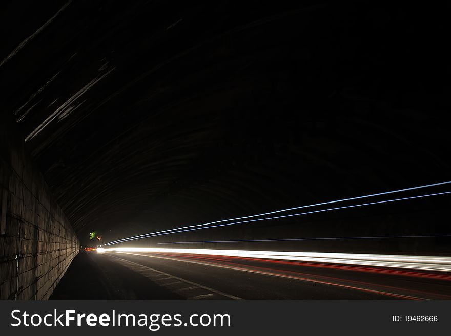 Car lights trails in a tunnel - long exposure photo taken in a tunnel below Veliko Tarnovo. Car lights trails in a tunnel - long exposure photo taken in a tunnel below Veliko Tarnovo