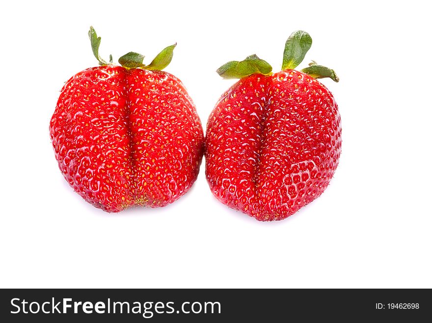 Two fresh red strawberries on a white background