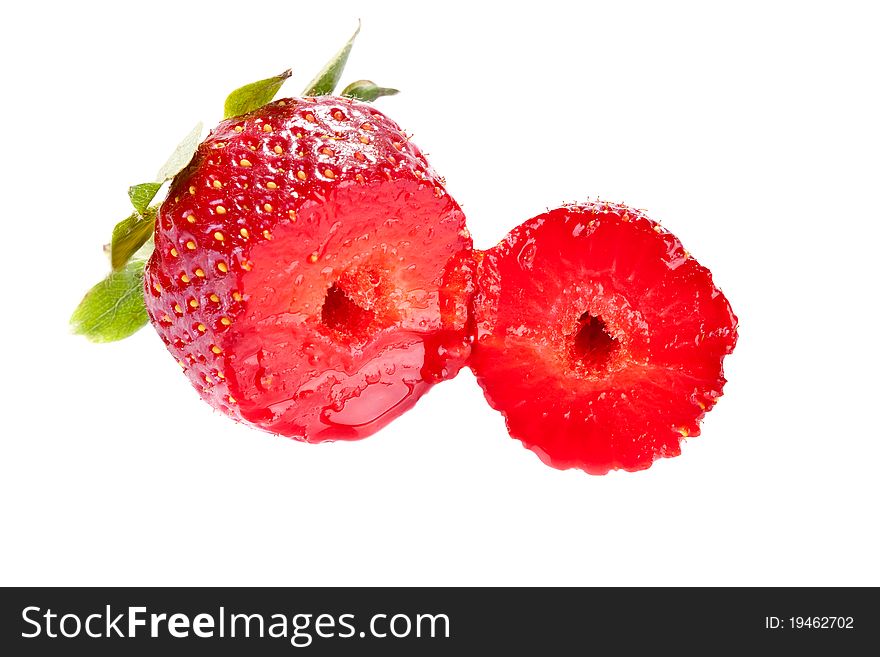 Juicy fresh cut strawberry isolated on white