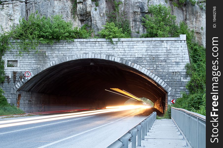 Car lights trails in a tunnel - long exposure photo taken in a tunnel below Veliko Tarnovo. Car lights trails in a tunnel - long exposure photo taken in a tunnel below Veliko Tarnovo