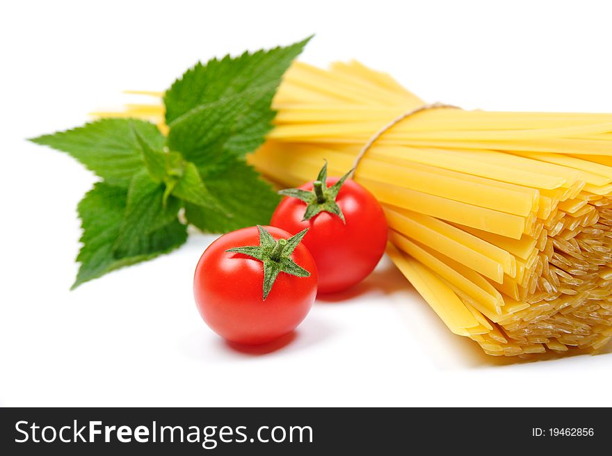 An image of two red tomatoes and pasta. An image of two red tomatoes and pasta