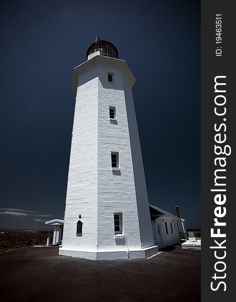 A lighthouse located in the Western Cape, South Africa. Slangkop is an Afrikaans word literally meaning Snake's head. A lighthouse located in the Western Cape, South Africa. Slangkop is an Afrikaans word literally meaning Snake's head.