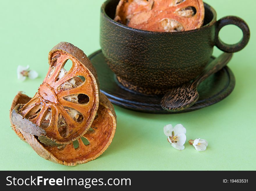 Bael Fruit tea and a cup from a coconut tree