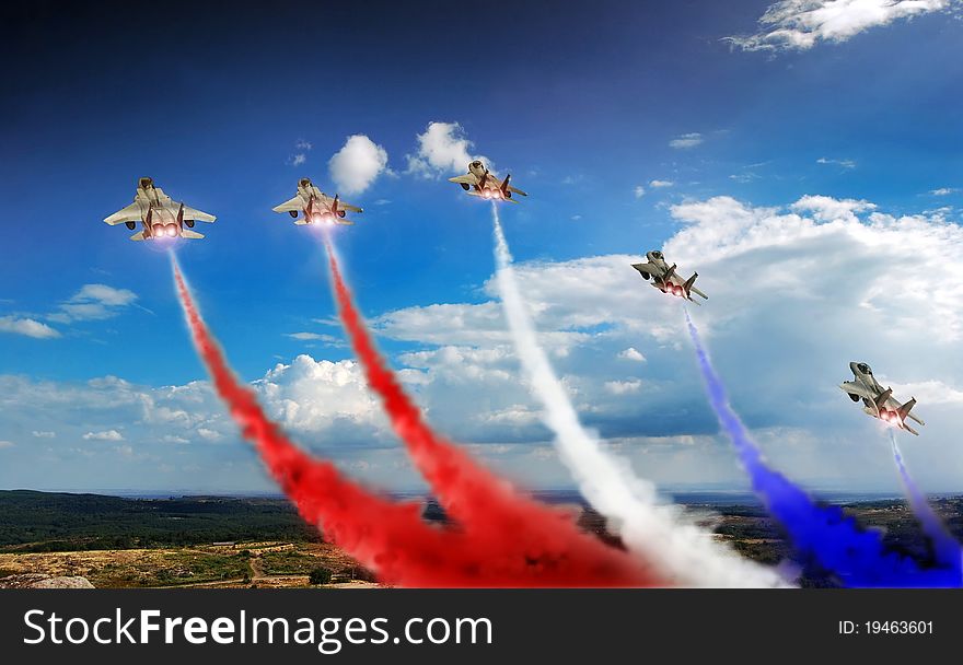 Five F15 fighters in exhibition, with blue and red colored smoke. Five F15 fighters in exhibition, with blue and red colored smoke.