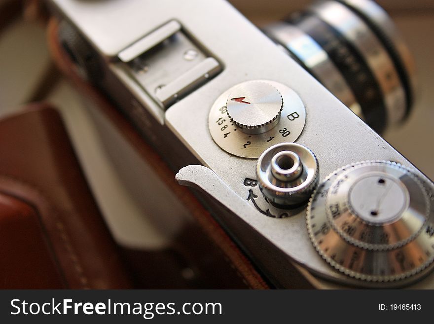 The ancient film camera from metal close up. The ancient film camera from metal close up