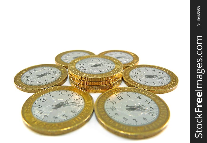 Coins in the form of hours on a white background. Coins in the form of hours on a white background