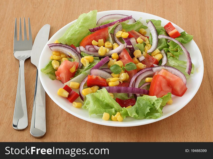Vegetable salad with corn and onion