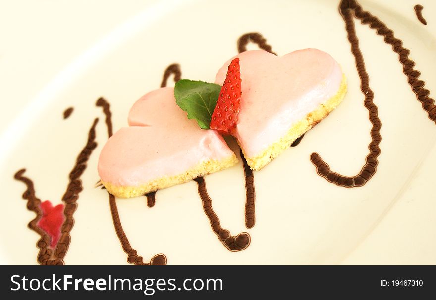 Strawberry cake on yellow plate. hearts. Strawberry cake on yellow plate. hearts