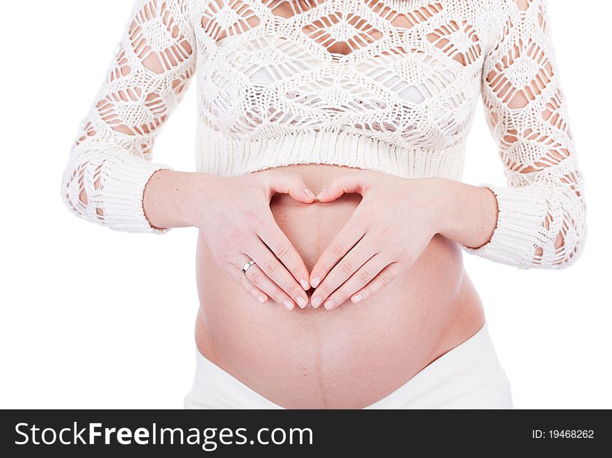 Pregnant woman show heart sign on her belly