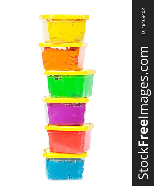 A stack of jars with plasticine of different colors