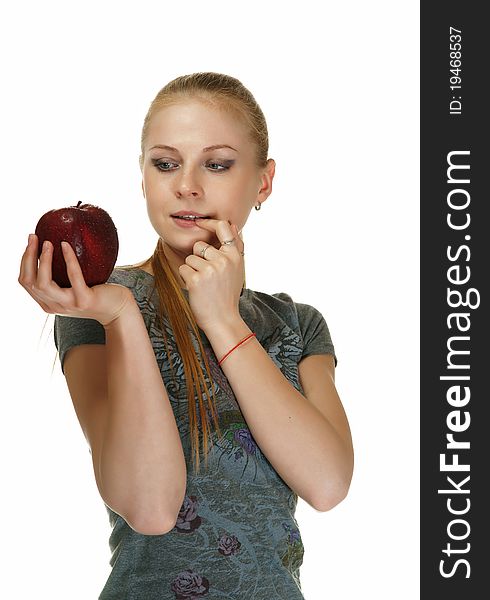 The blonde with an apple on a white background