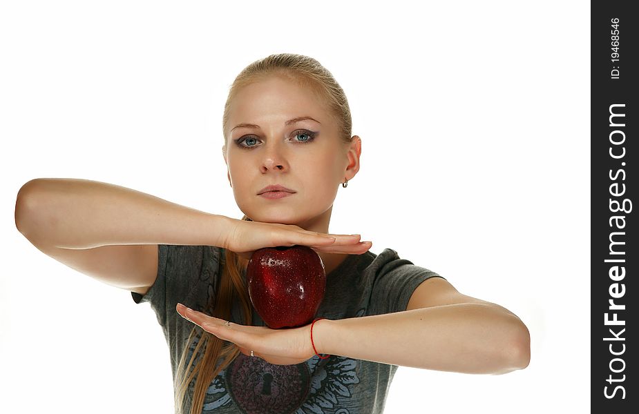 The blonde with an apple on a white background