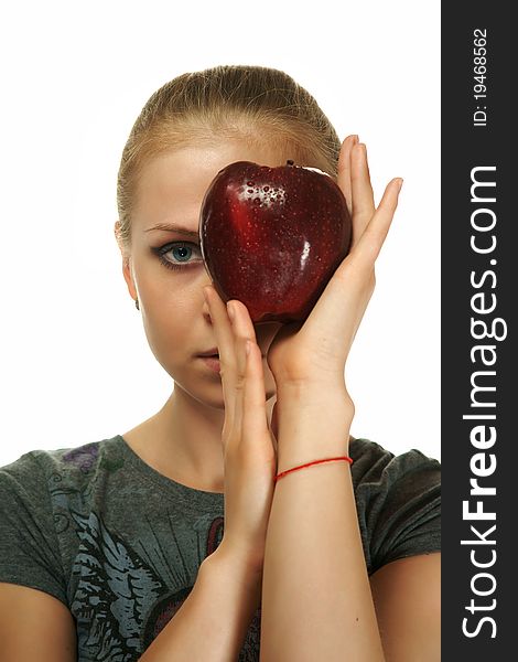 The blonde with an apple on a white background