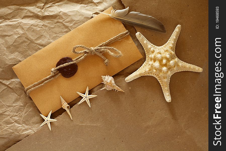 Envelope on the paper with seashells. Envelope on the paper with seashells