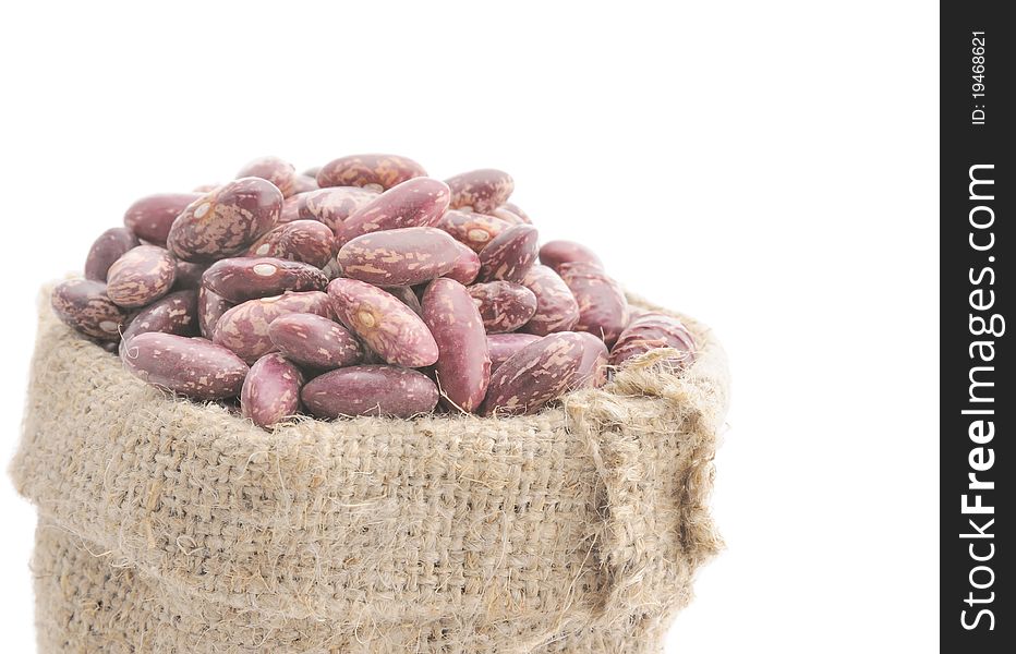 Seeds of beans in a bag. Brown beans in a linen bag.