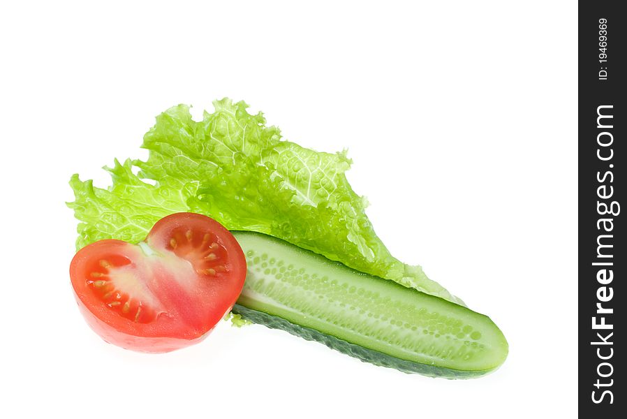 Tomato, cucumber and lettuce on a white background. Tomato, cucumber and lettuce on a white background
