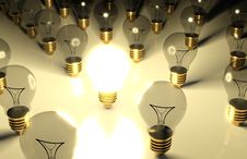 One Glowing Light Bulb And The Other Light Bulbs Stock Photography One Glowing Light Bulb And The Other Light Bulbs Stock Photography