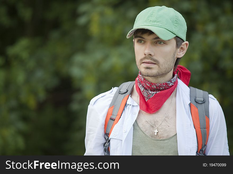 Portrait of hiker with backpack on the way