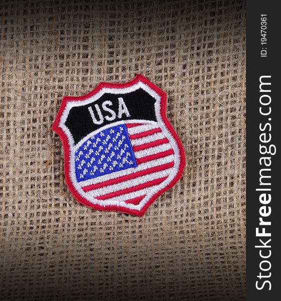 A cloth badge depicting the emblem of the USA. A cloth badge depicting the emblem of the USA.