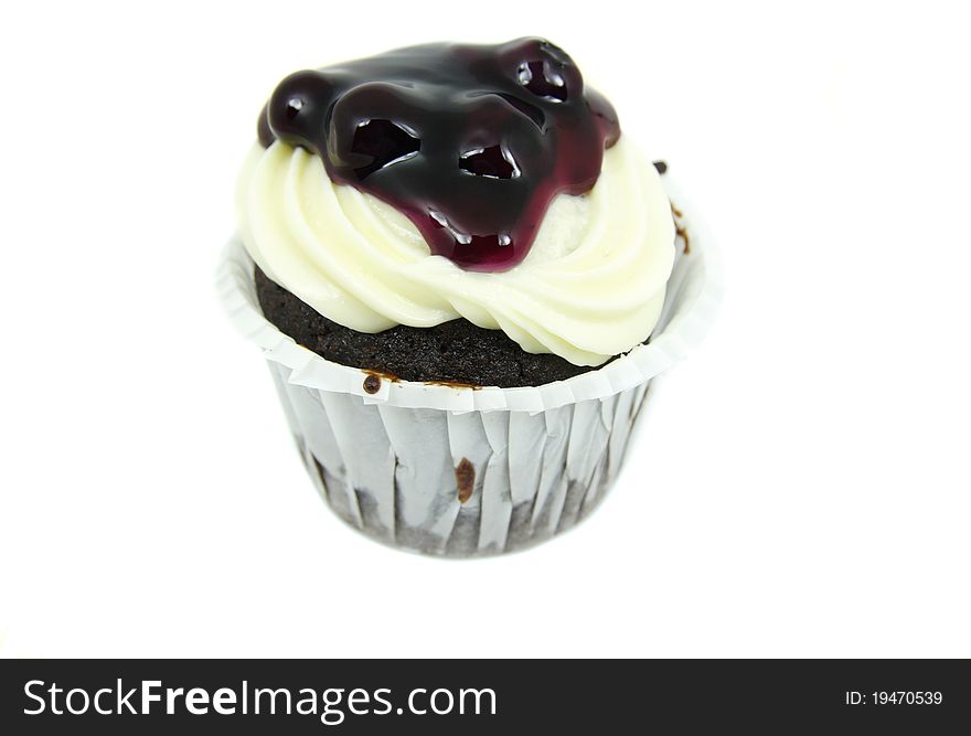 Cake chocolate with cream cheese and fresh blueberries isolated on white