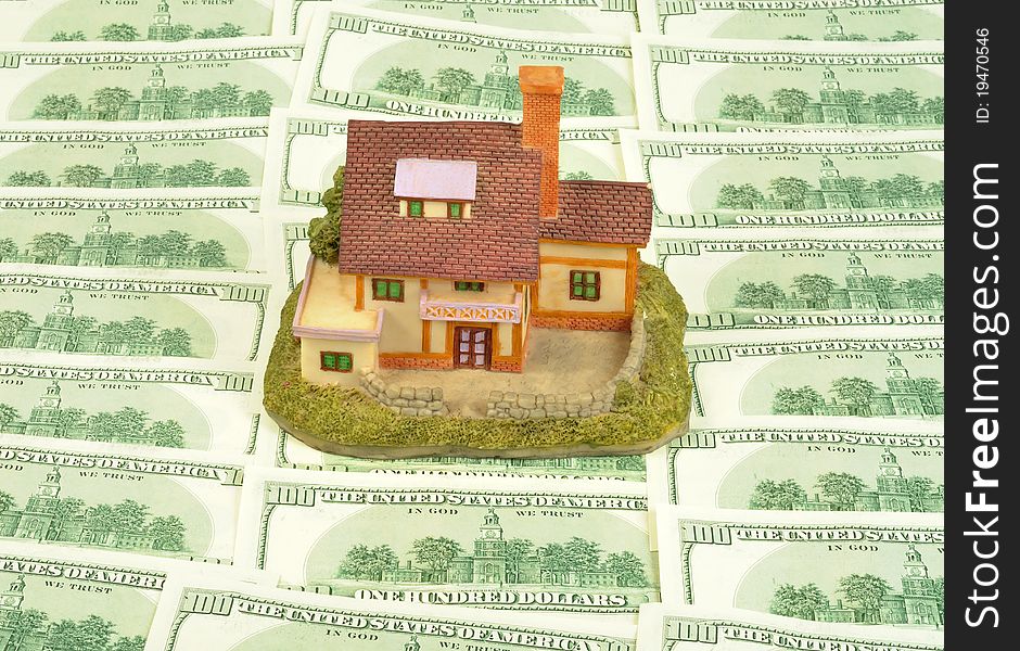 House on American Dollars background, close up shot. House on American Dollars background, close up shot