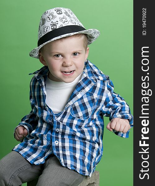 Adorable little boy wearing blue plaid shirt. Adorable little boy wearing blue plaid shirt