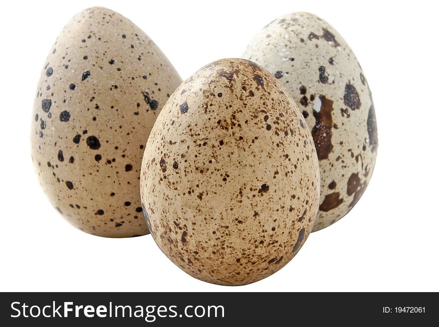 Three quail eggs on the white background