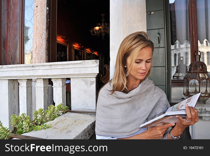 Beautiful young woman in Venice, horizontal shot.