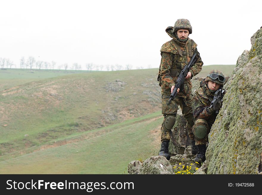 Two soldiers in heavy combative ammunition. Two soldiers in heavy combative ammunition