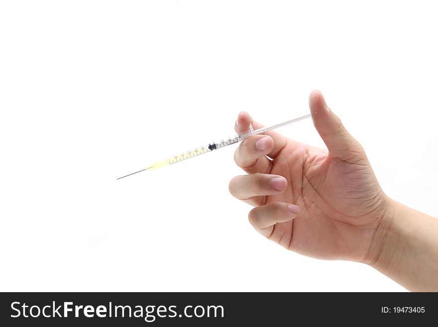 Hand hold disposable syringe isolated on the white background. Hand hold disposable syringe isolated on the white background