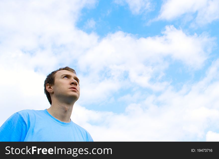 The Young Man Looks At The Blue Sky