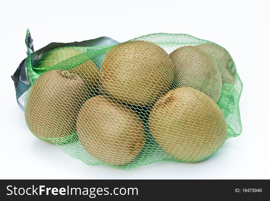 Kiwi fruits in a net bag on a white background. Kiwi fruits in a net bag on a white background