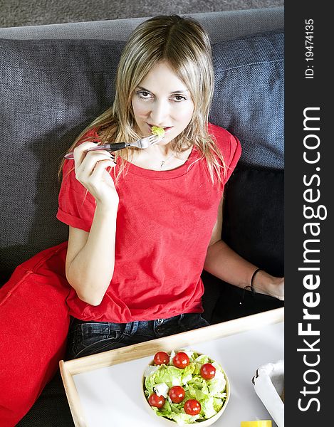 Beautiful blond woman eating a healthy meal