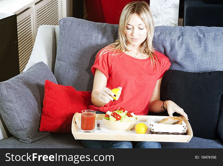 Beautiful blond woman eating a healthy meal