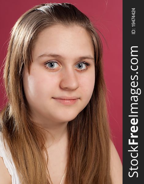 Close-up Portrait of girl studio isolated on red. Close-up Portrait of girl studio isolated on red