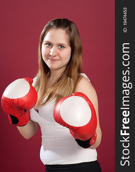 Portrait of girl in boxing gloves