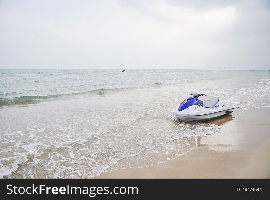 A mortorboat stop in the beach sand water. A mortorboat stop in the beach sand water.