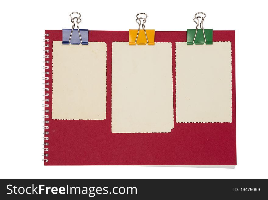 Empty photo on red notepad with binderclip. Isolated on white background