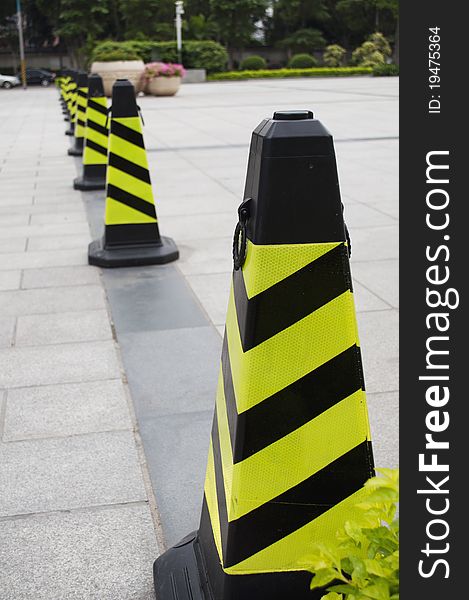 A road cone with reflective bands. A road cone with reflective bands